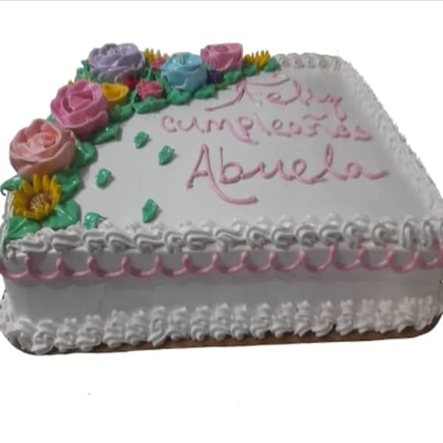 Cake Grande para CumpleaÃ±os -Diametro: ancho: 35cm Largo: 50cm Alto: 8-10cm, panetela sabor vainilla, relleno natilla y decoracion de flores
